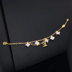 TimiLOGO 6 MOTIF STAR AND SUN GOLD BRACELET